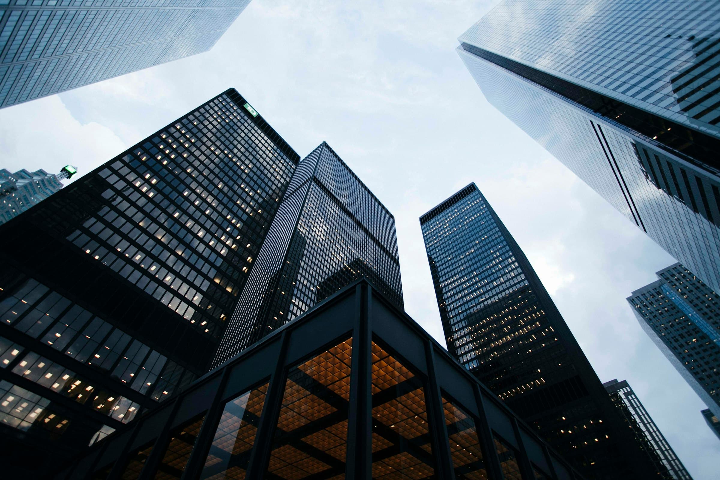 Glass skyscrapers in a financial district against a clear sky